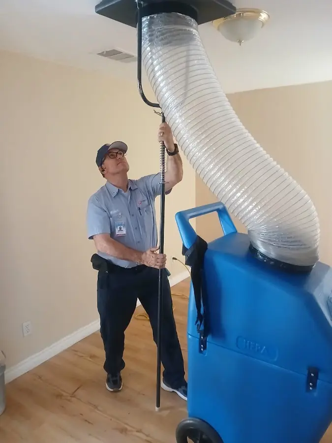 Furnace Tune-Up technician using HEPA equipment in Pasadena Hills